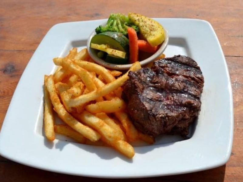 The filet mignon with french fries and vegetables at Anglers