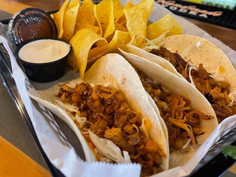 Chicken tacos with tortilla chips and queso