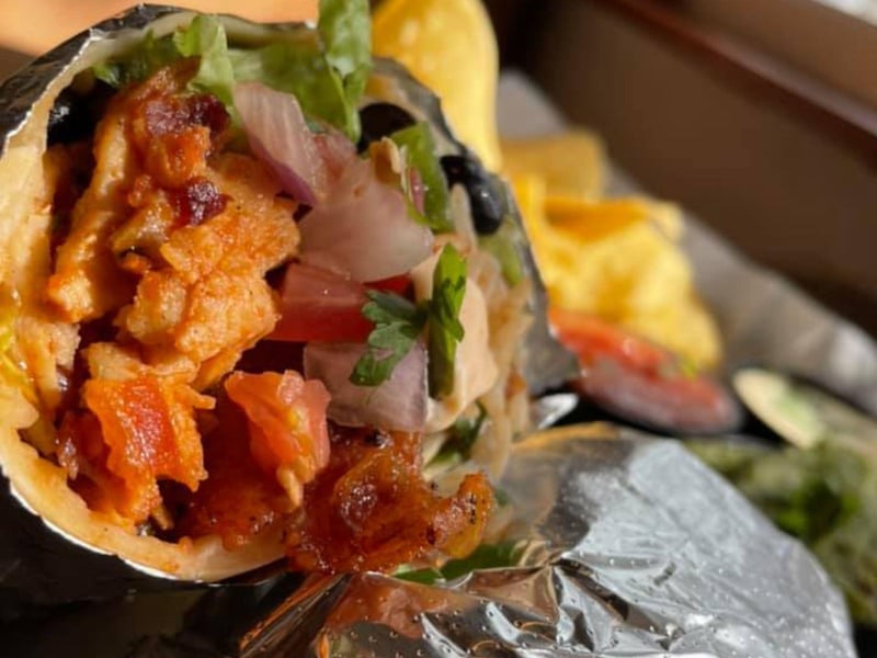 The spicy roasted red chicken and bacon burrito