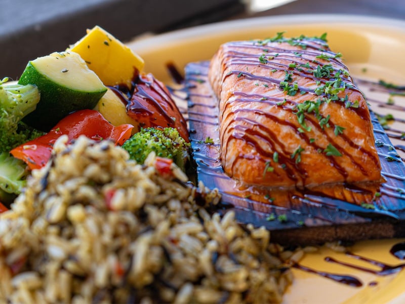 The cedar plank salmon with house rice and fresh vegetables