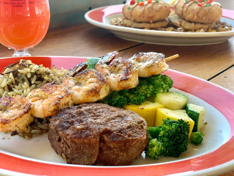 The filet and shrimp with confetti rice and a vegetable medley