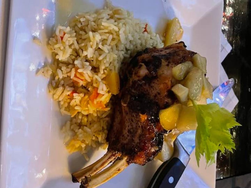 A 14 oz grilled carrabotta pork chop with rice pilaf