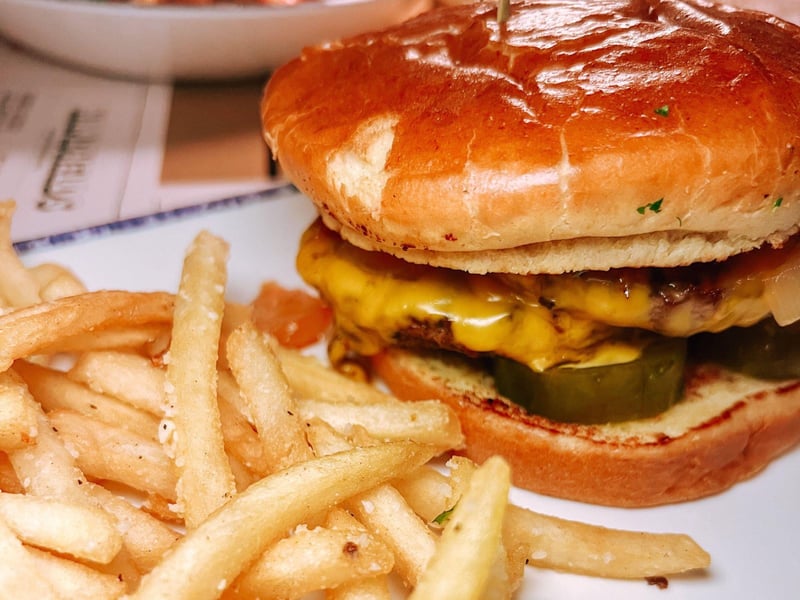 A cheeseburger with fries at The Remedy in Fort Walton Beach, Florida