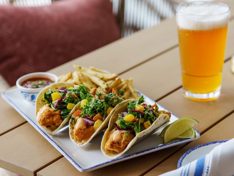 Fried fish tacos with house salsa and mango slaw from The Remedy