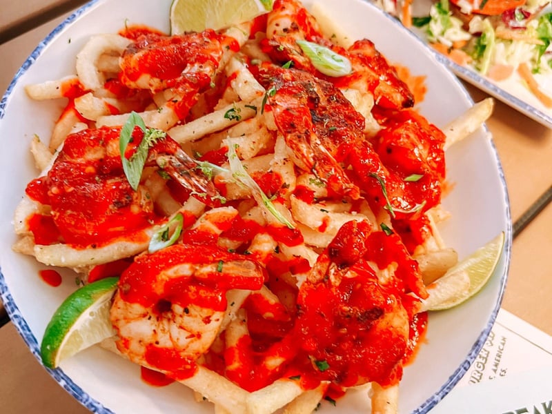 Spicy chili lime and shrimp smothered fries at The Remedy