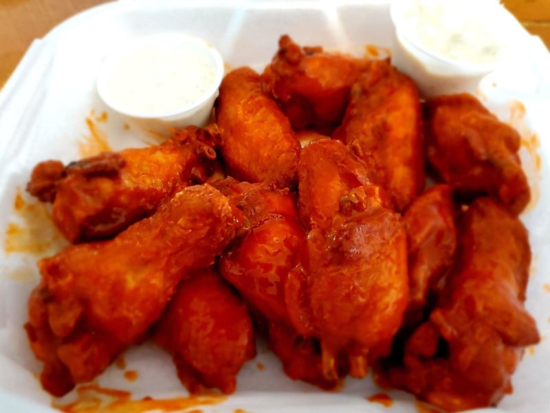Spicy hot chicken wings served with ranch or blue cheese in Apalachicola, Florida