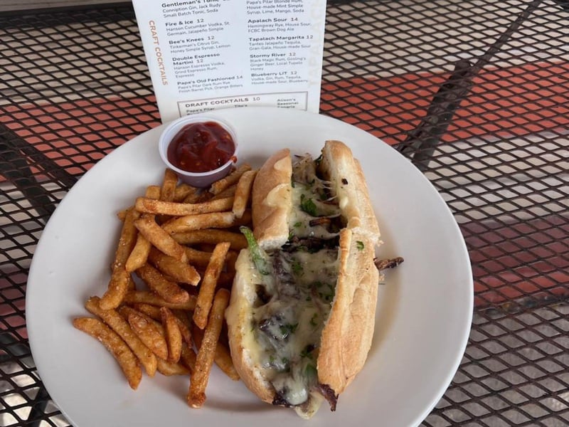 The Philly steak and cheese with fries from the Owl Cafe in Apalachicola, Florida