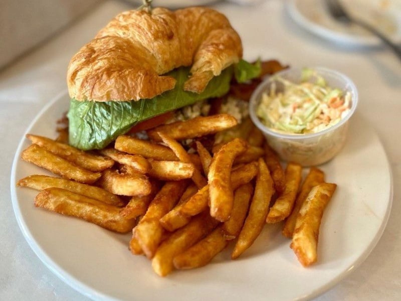 The chicken salad sandwich on a croissant