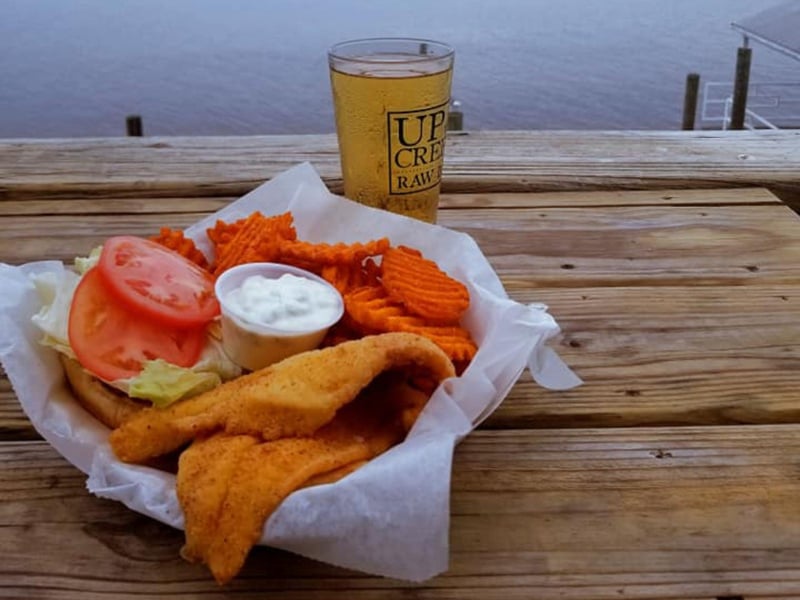 A fried fish sandwich with sweet potato fries from Up the Creek Raw Bar in Apalachicola, Florida