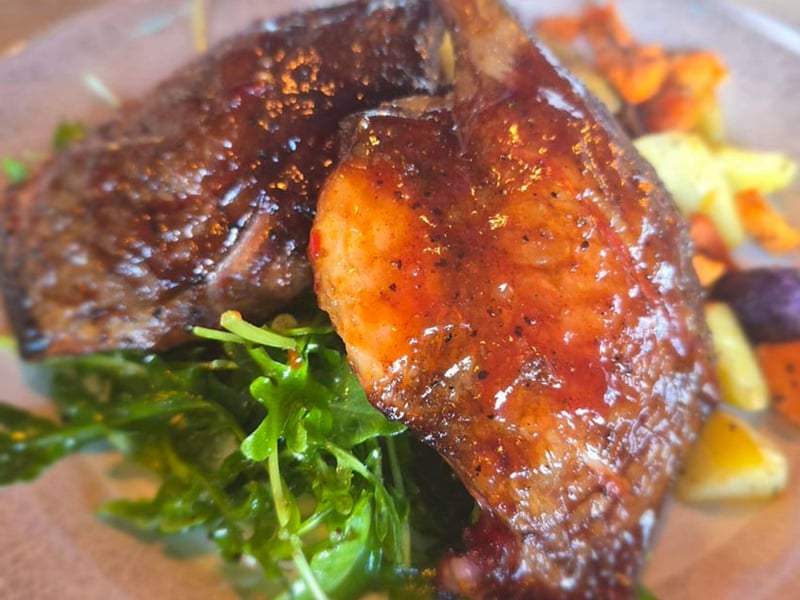 Korean smoked duck legs with roasted potatoes at Half Shell Dockside in Apalachicola, Florida