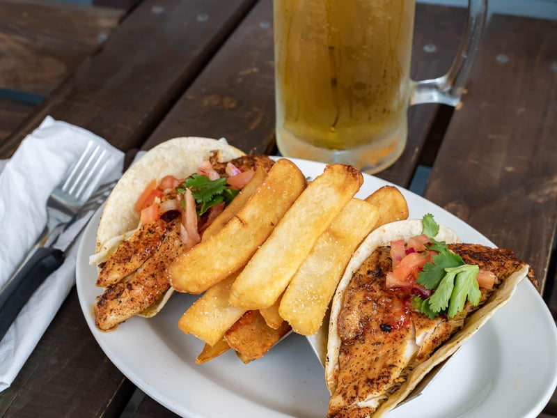 Fresh fish tacos with fries
