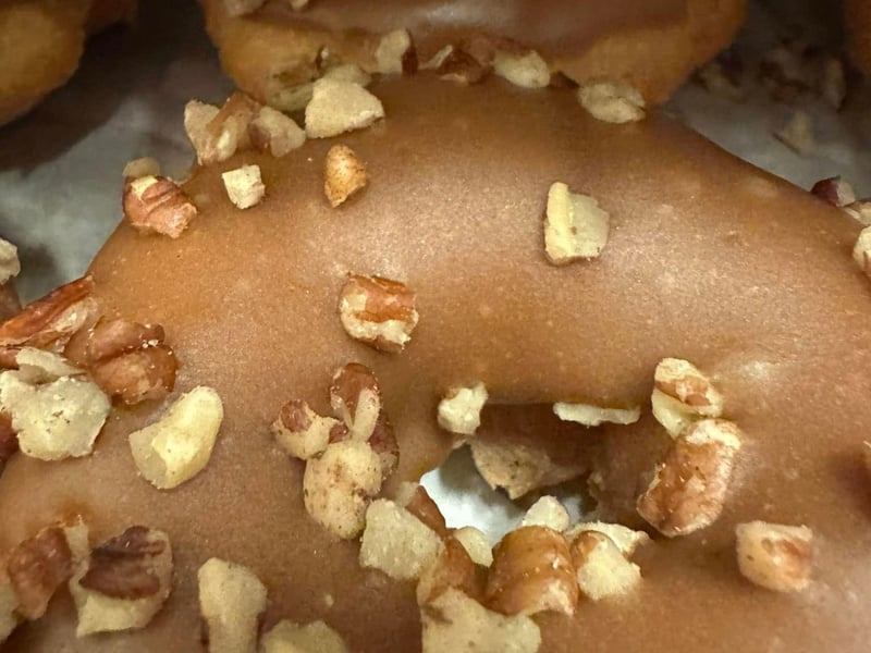 A fresh maple pecan donut