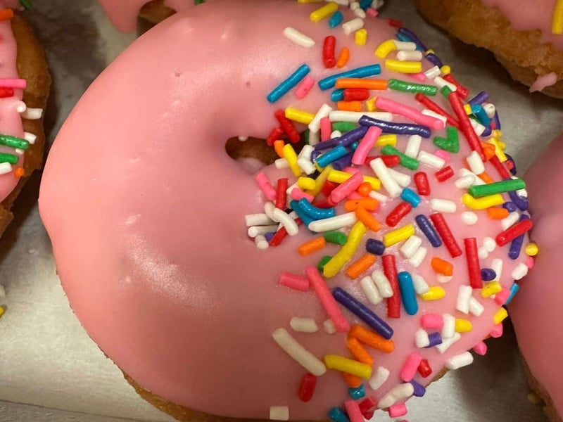 Pink frosted donuts with rainbow sprinkles at Webers in Cape San Blas, Florida