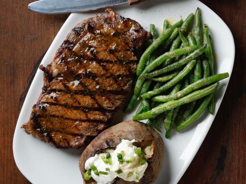 A steak with sides from AJs Grayton Beach