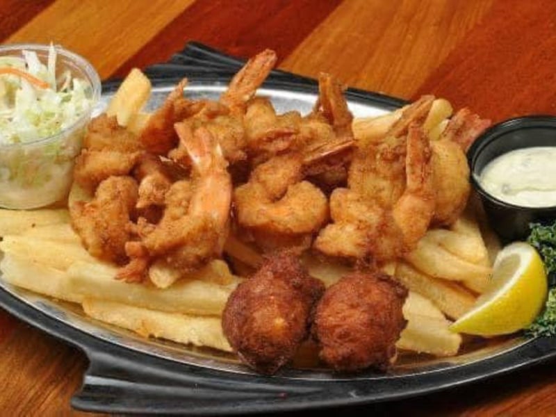 Fried shrimp with hush puppies and fries