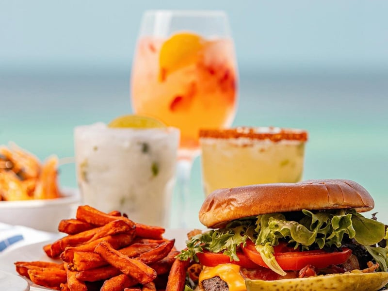 A cheeseburger with sweet potato fries