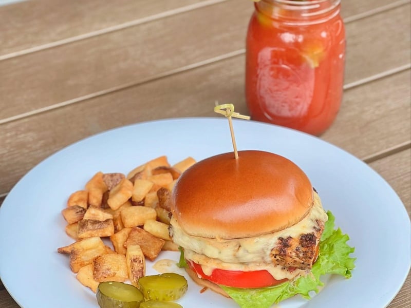 A Gulf Snapper sandwich with breakfast potatoes