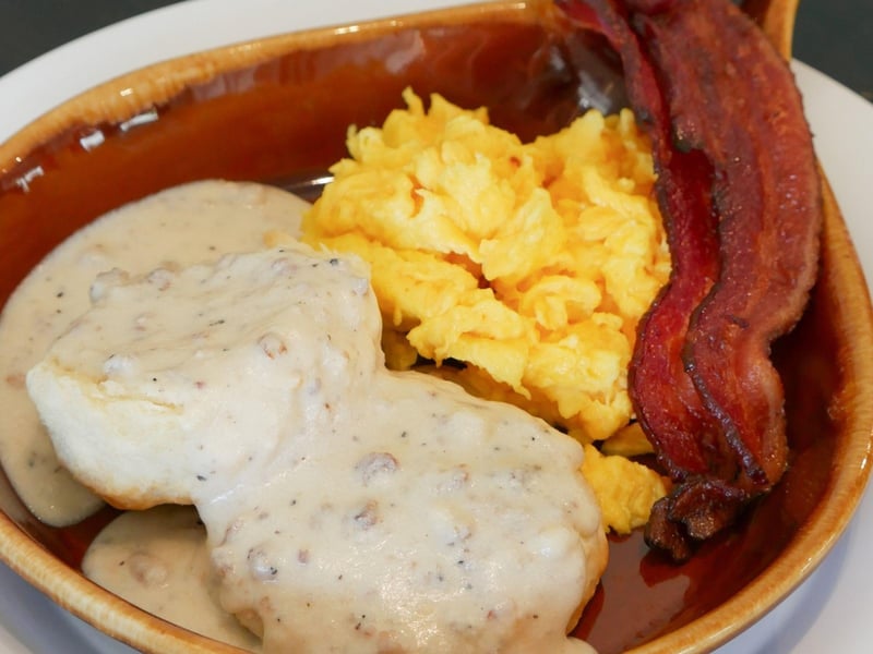 Biscuits and gravy with eggs and bacon