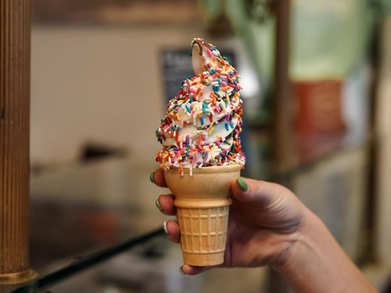 A vanilla chocolate frozen yogurt swirl with sprinkles