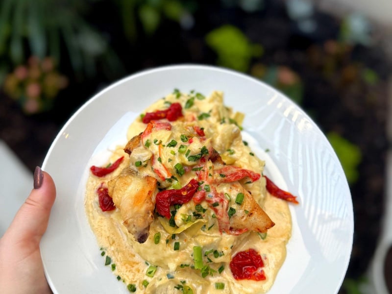 Joyce Farms grilled chicken with tomatoartichoke cream