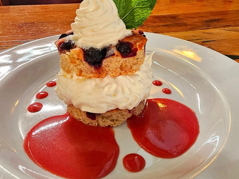 An ice cream sandwich with bluberry focaccia and vanilla ice cream