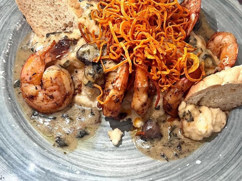 Grits a Ya Ya with blackened shrimp and Gouda cheese grits