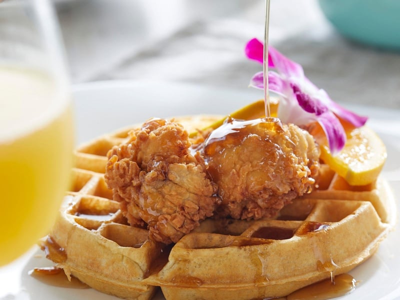 Chicken and waffles with a mimosa