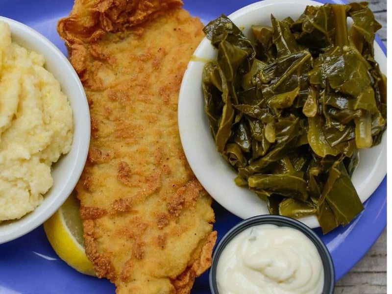 Fried catfish with potatoes and collard greens