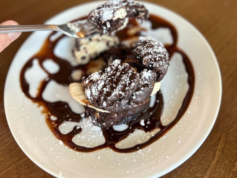 A triple chocolate cookie sandwich with whipped espresso