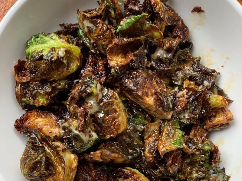 Crispy brussels sprouts topped with sesamehoney reduction