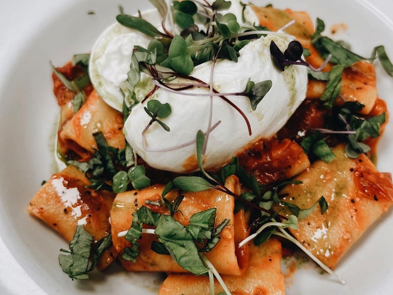 Rigatoni alla Caprese topped with fresh mozzarella