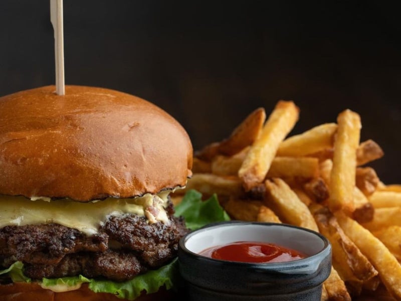 A cheeseburger with fries at Pescado