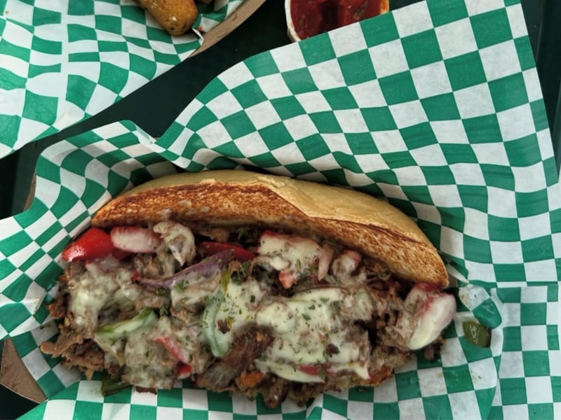 A Philly Cheesesteak made with top sirloin steak and white American cheese