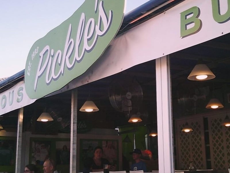 The sign for Pickles Burgers and Shakes on Highway 30A
