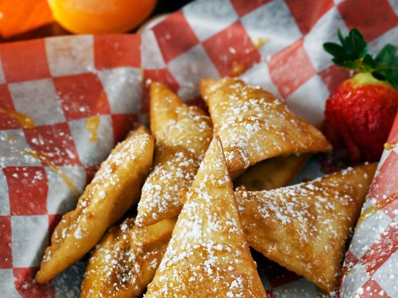 Sopapillas drizzled with homemade caramel sauce