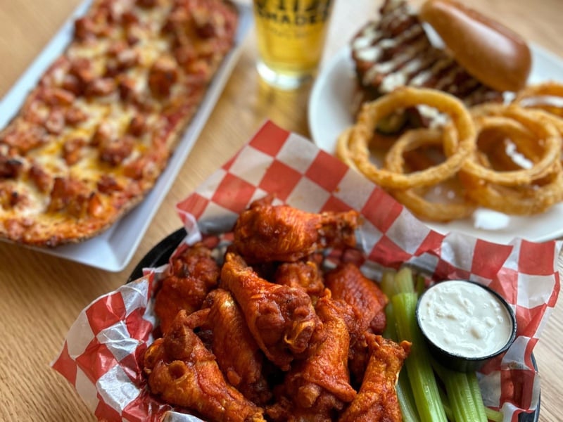 Chicken wings with onion rings and a flatbread