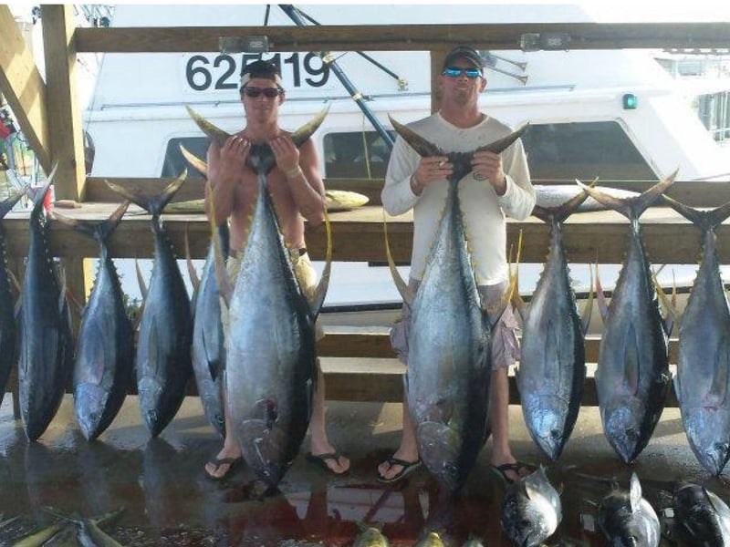 A group showing off their catches from Vengeance Charters