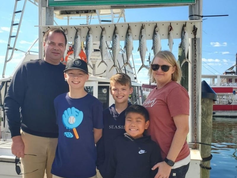 A family on the dock at Harborwalk Marina