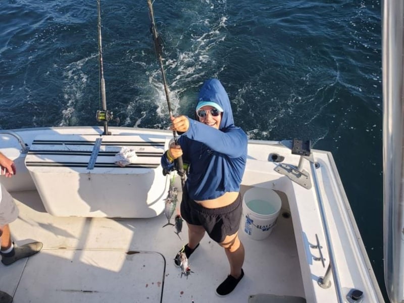 A woman with her catch on board Charter Boat Starfire