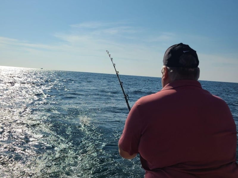 A man fishing off the boat in Destin, Florida