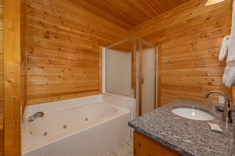 Jacuzzi in a bathroom at Grizzlys Den, a 5 bedroom cabin rental located in Gatlinburg