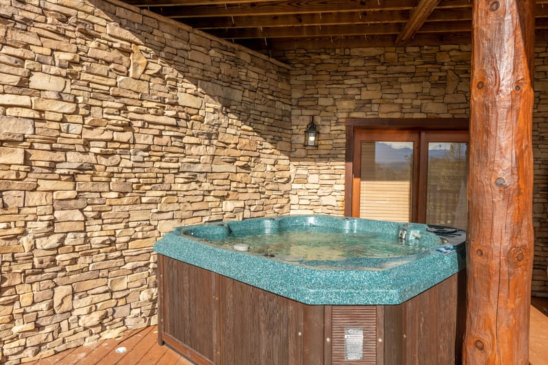 Hot tub on the lower deck at Grizzlys Den, a 5 bedroom cabin rental located in Gatlinburg