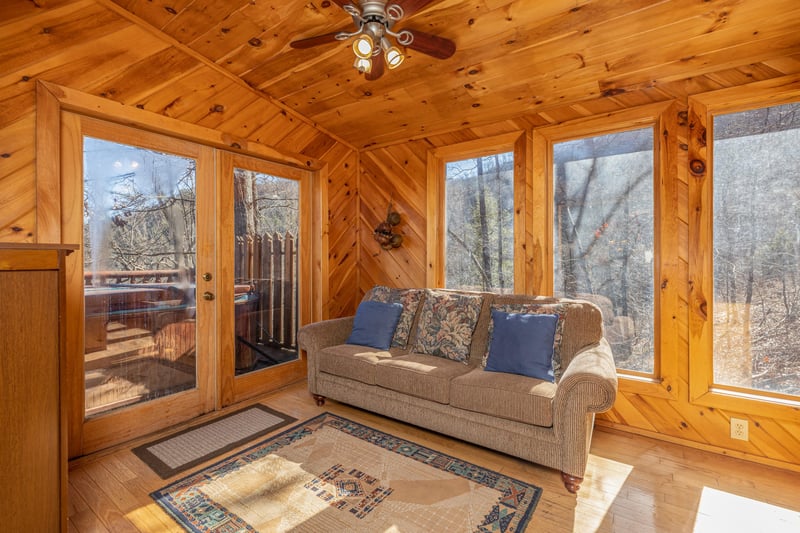 Sitting room with sofa at Hatcher Mountain Retreat a 2 bedroom cabin rental located in Pigeon Forge