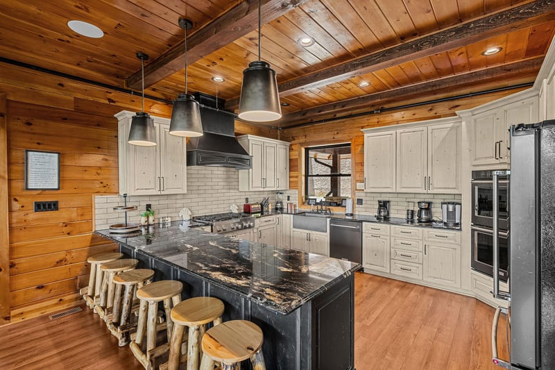 Breakfast bar with seating for five at Black Bears  Biscuits Lodge, a 6 bedroom cabin rental located in Pigeon Forge