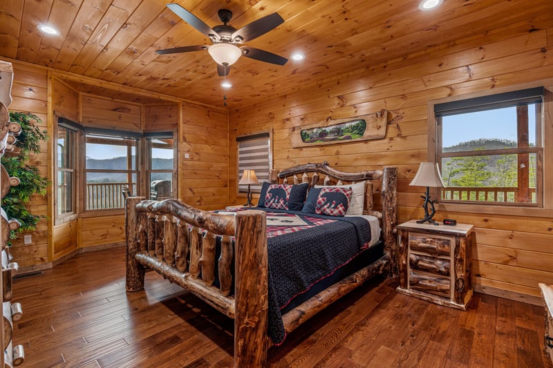 King log bed at Four Seasons Grand, a 5 bedroom cabin rental located in Pigeon Forge