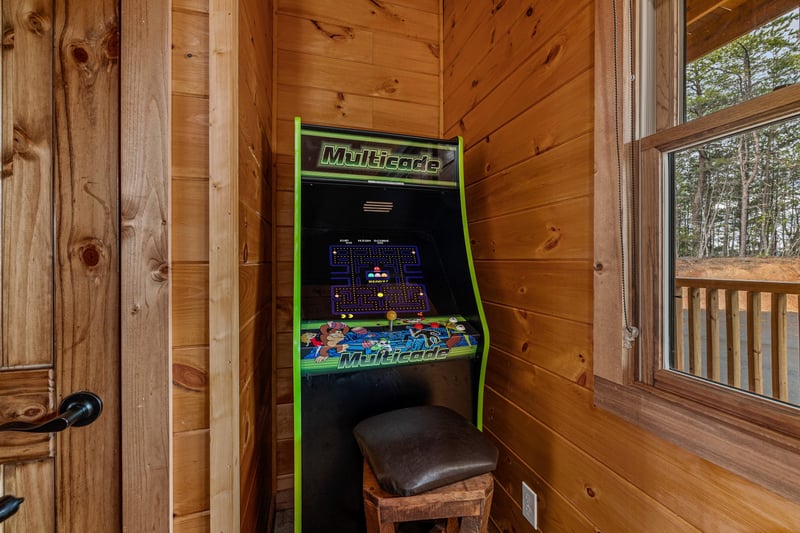 Arcade game at Four Seasons Grand, a 5 bedroom cabin rental located in Pigeon Forge