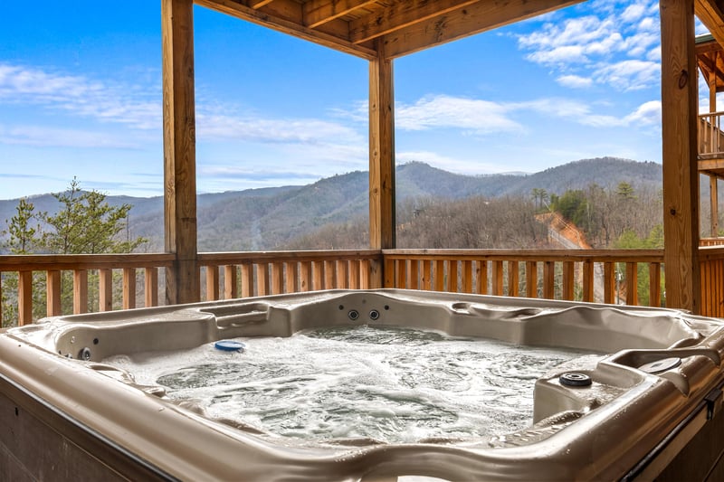 Hot tub at Four Seasons Grand, a 5 bedroom cabin rental located in Pigeon Forge