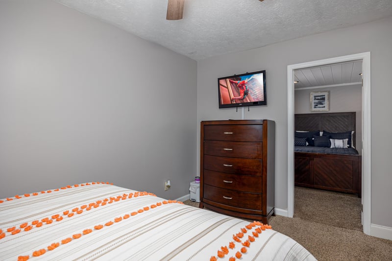 Bedroom dresser and flat screen tv at Hoop Dreams Lodge