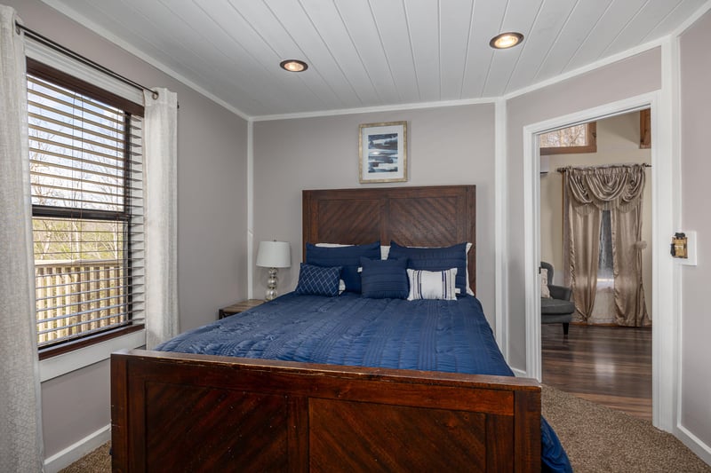 Bedroom with Nightstand at Hoop Dreams Lodge