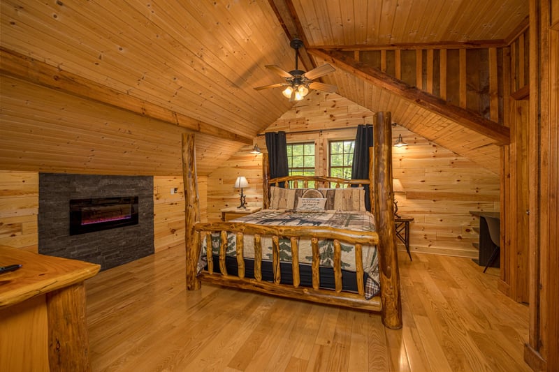 Loft Bedroom with Fireplace at Moonlit Mountain Lodge